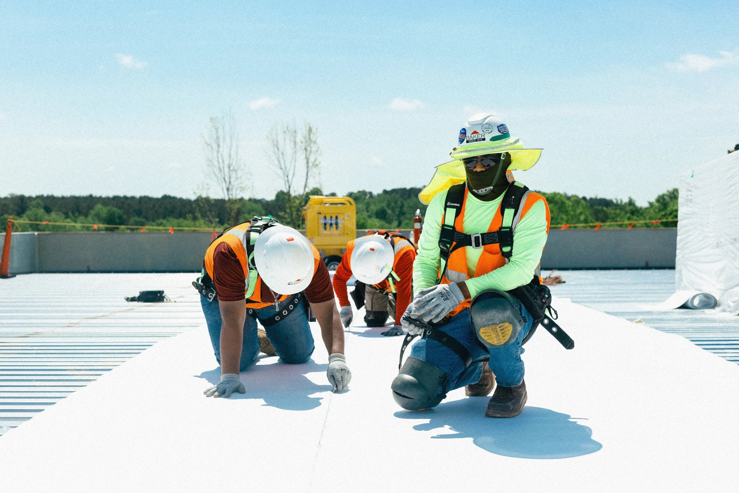 Roofing crew working on a commercial roof